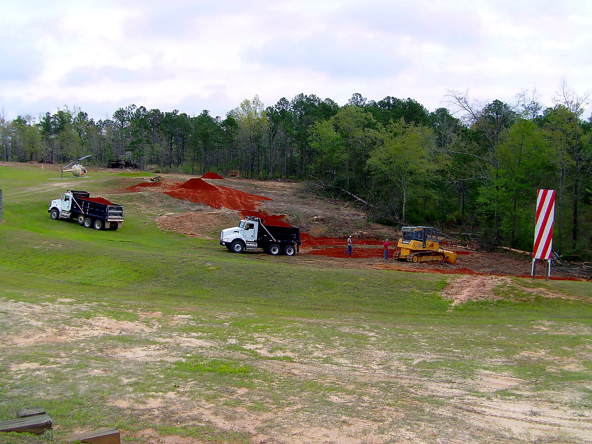 Crews and heavy equipment completing range improvements at a military training site