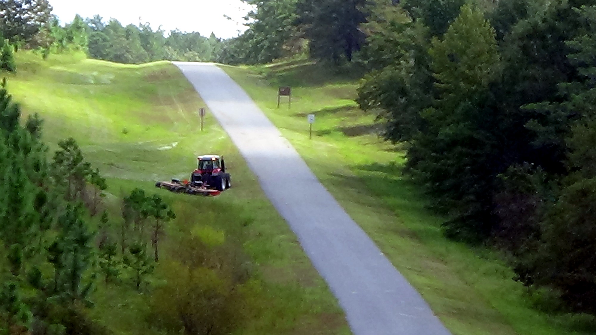Mowing operations beside a paved range road